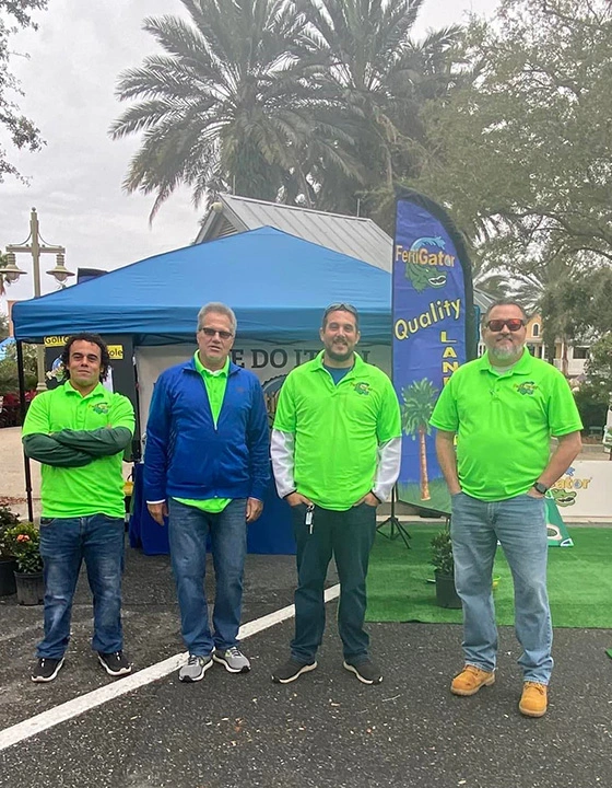 The FertiGator Lawn Care owner and management team promoting our premium services.