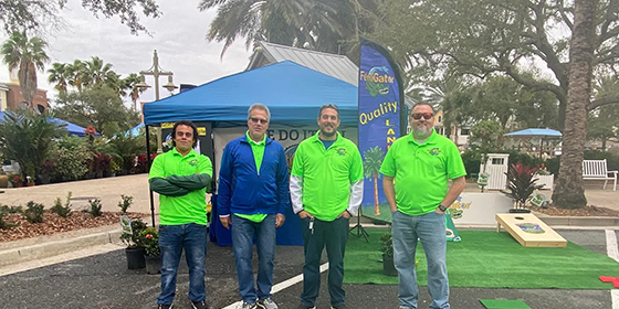 FertiGator Lawn Care employees and owner at a promotion event near The Villages, FL.