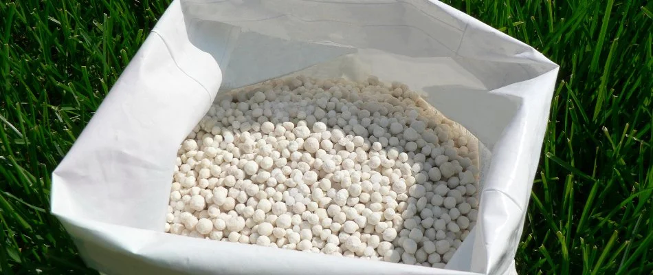 Granular fertilizer in a white bag on a property in The Villages, FL.