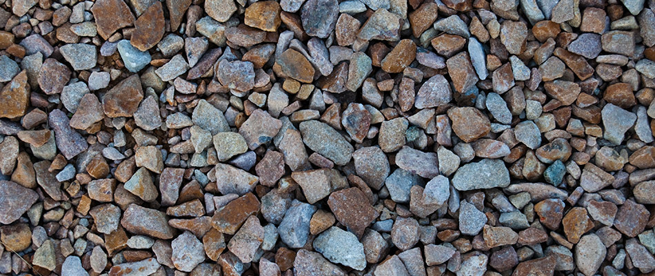 Close up of rust colored granite rocks in a landscape bed near The Villages, FL.